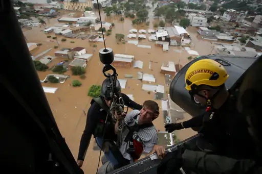 People are being rescued from flood affected areas through helicopters.
