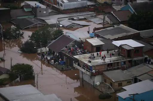 Floods in Brazil: Due to floods, people have been forced to live on the rooftops of their houses.